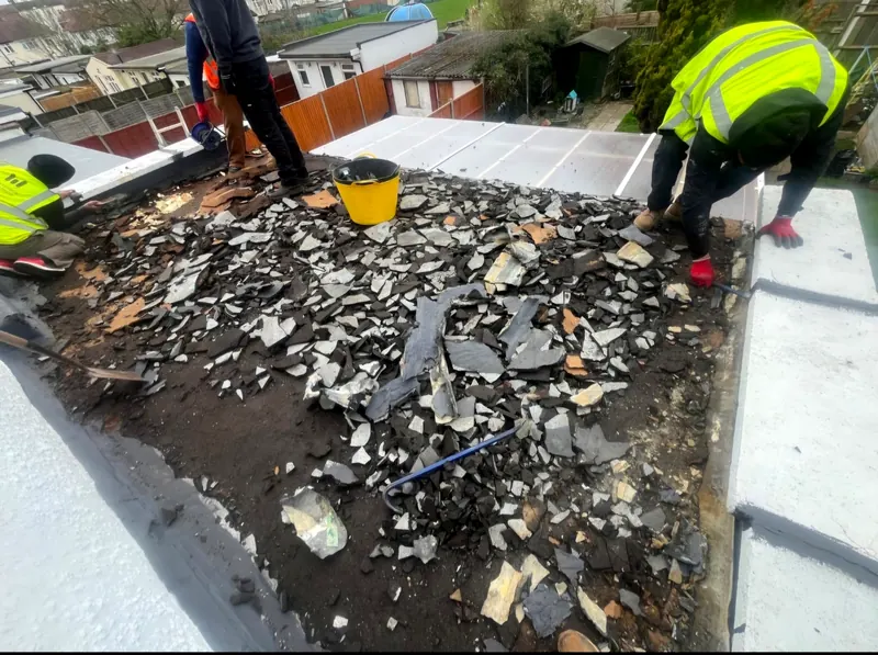 An old flat roof stripped back to the boards